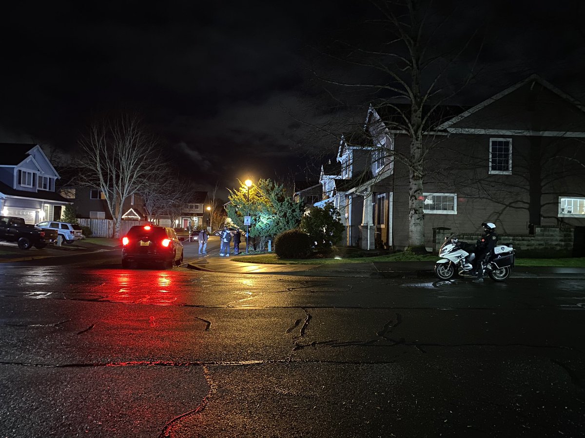 just_somefucker's tweet image. Small groups of protesters are going through neighborhoods in Tigard posting up signs with mental health resources. Police are following the groups. A protester could be heard saying “you are making our jobs easier,” when officers shined a spotlight on them.