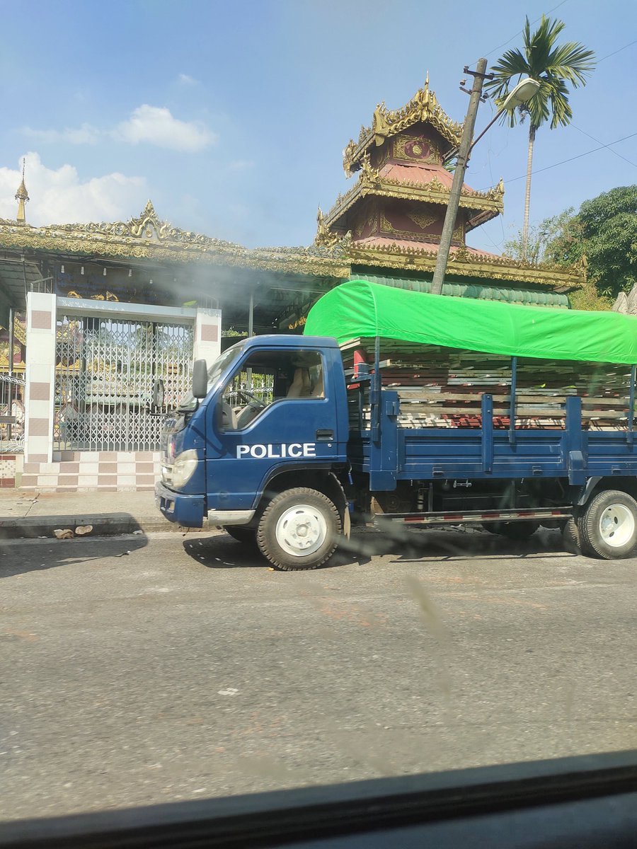 Police personnel carriers at Shwedagon Pagoda. Rumors are that the monks will demonstrate there and turn over their alms bowls. This is a powerful symbolic gesture that precipitated the violence against monks during the Saffron Revolution in 2007.