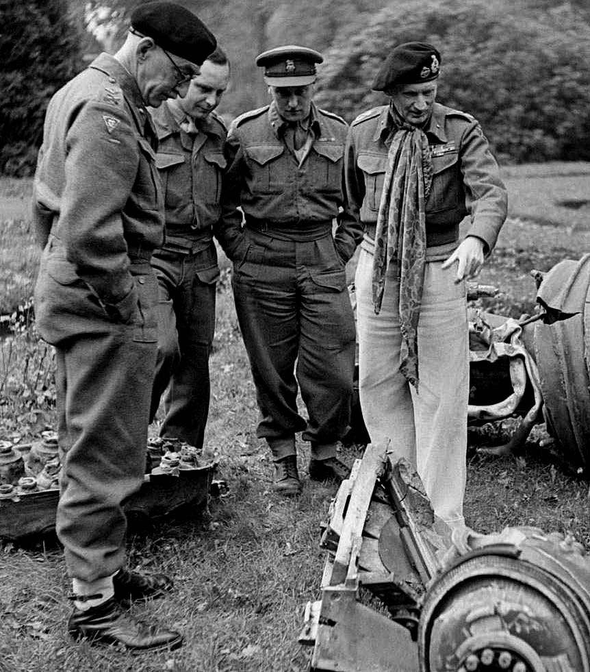 Absolutely no idea what Monty is doing here - suspect that not just a knighthood but making Field Marshal means you can just DIY your dress of the day/uniform for comfortable trousers, a camo scarf adrift, and a beret that was last bashed in 1942
