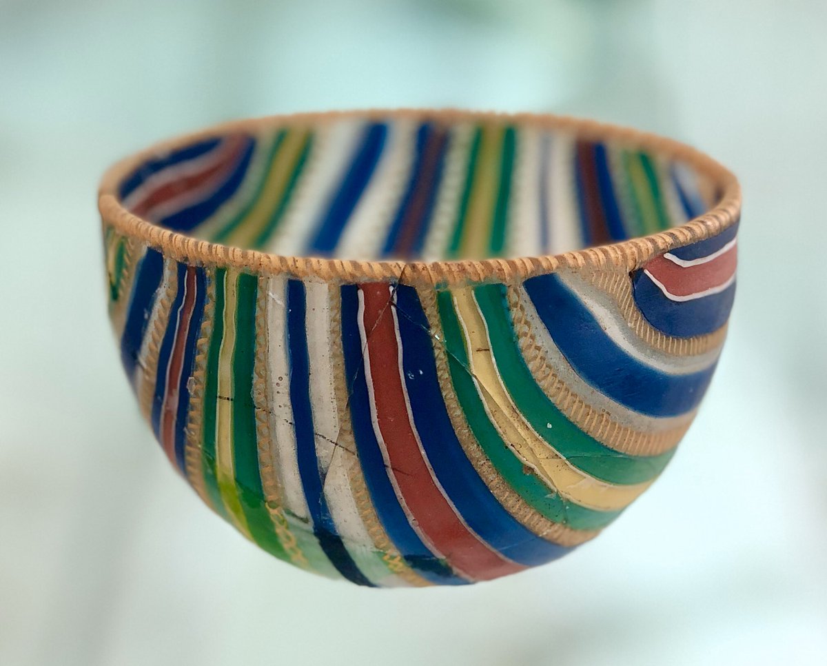 Technicolor dreambowl, found in a grave near Zadar on Croatia's Dalmatian Coast. Made by melding and winding thin bars of glass, each adulterated with different minerals to get different colors. 1st century AD.  Zadar Museum of Ancient Glass  https://bit.ly/3tAbzB4 