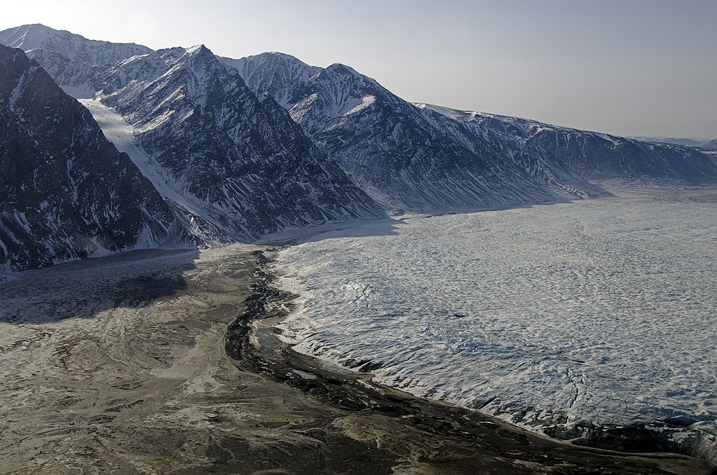 3. Glaciers tend to carry sediments of varying sizes, and deposit them when they get tired (JK, but let's not go into that here). These deposits are called moraines. One type of moraine is called a terminal moraine. It looks like this:(Source: Wikipedia page on Wordie glacier)