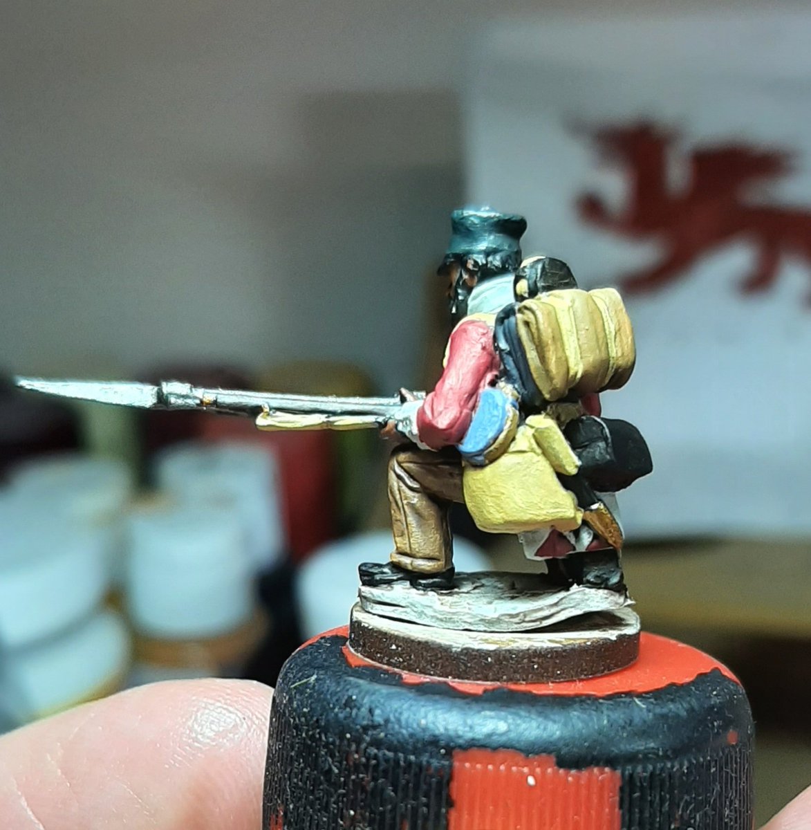 Next block in all the colours as carefully as you can, this chap is serving in South Africa in the 1850's but has all the straps of a Napoleonic soldier. He hasn't pipe clayed his straps and so the natural leather colour is bleeding through, giving it a creamy colour.