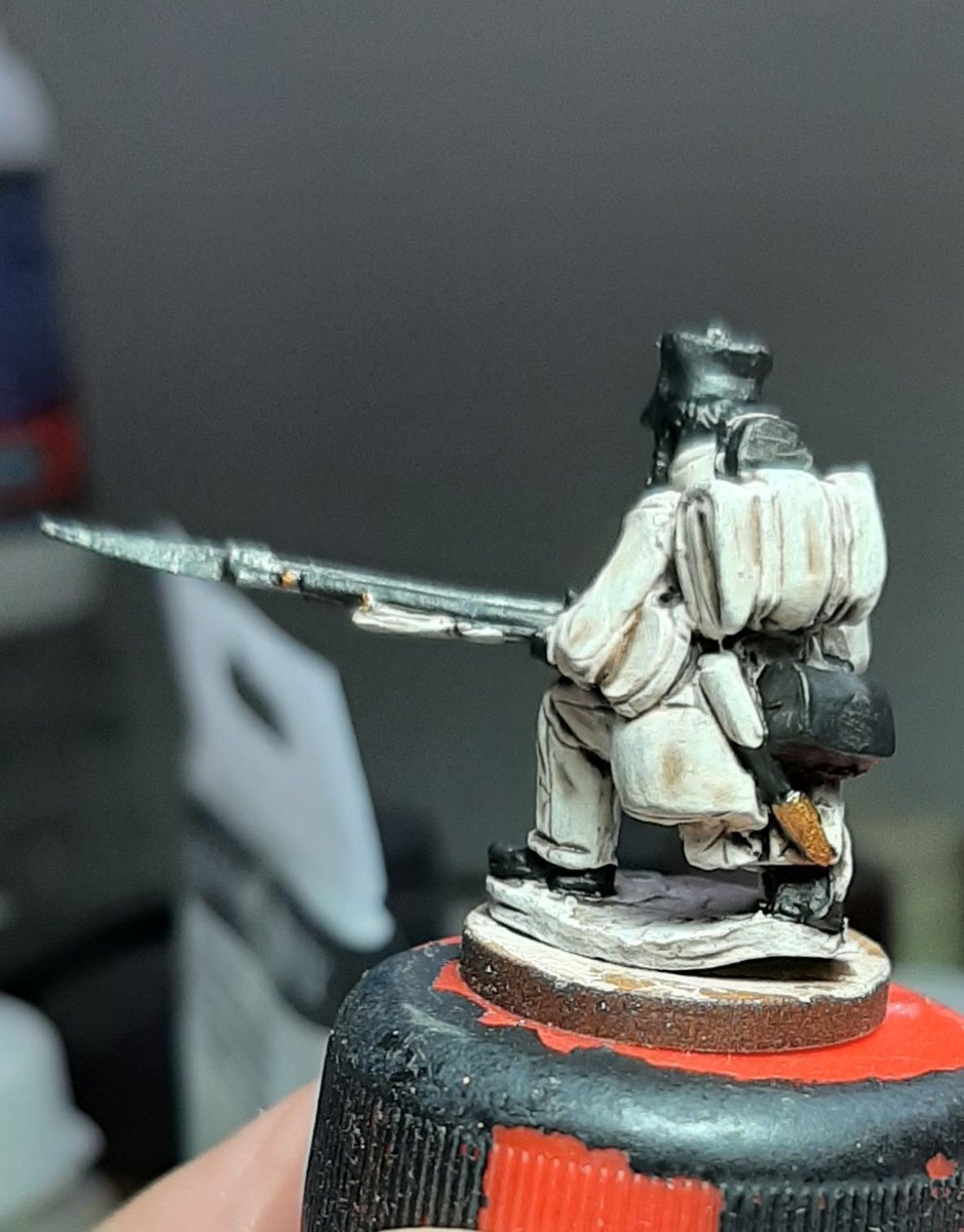 Next I painted some areas of the figure black, flesh and metal areas mostly and the areas that are black in colour like boots and ammo pouch.Paint the barrel and bayonet dark silver and areas of gold err gold, wash the silver with strong tone and the gold with brown ink