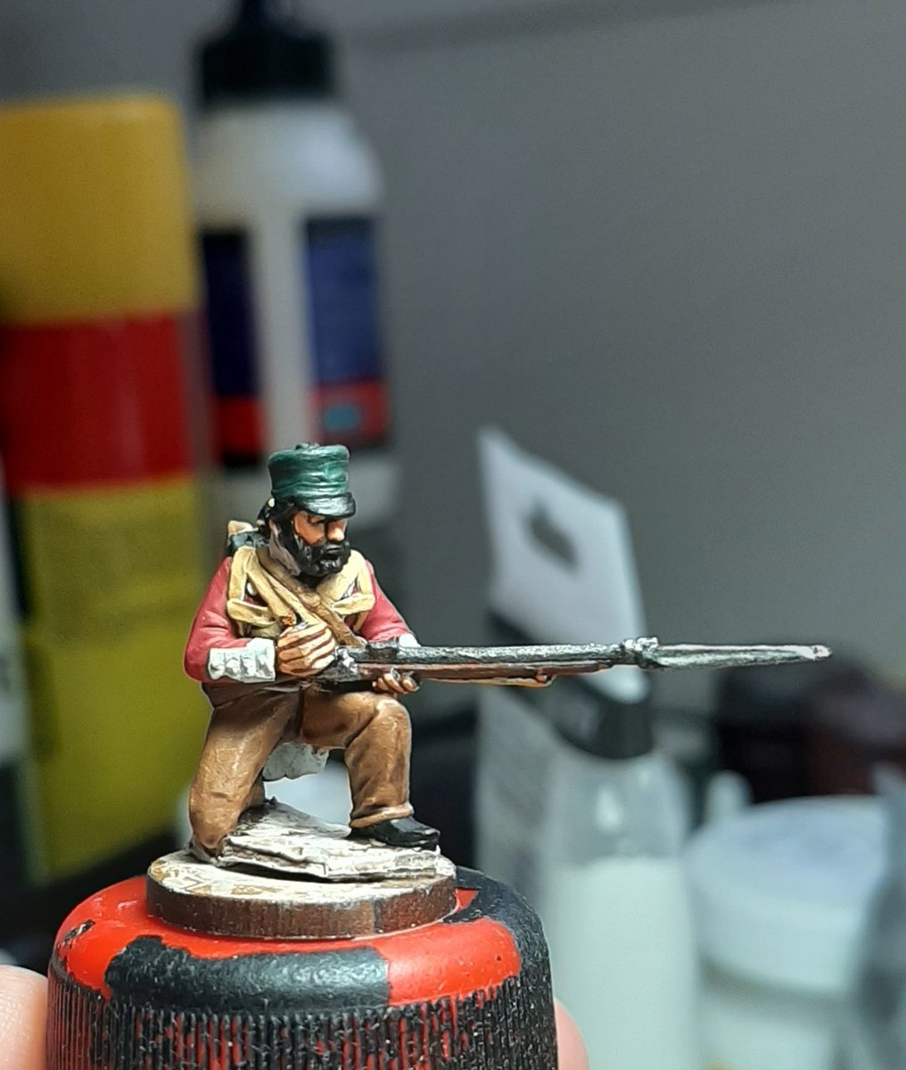Next we take the colours up a level, hopefully you can see a little more depth, to add to the weathering the white on the coat will be left a light grey, initial woodgrain is added to the musket and flesh is painted onto hands and face.