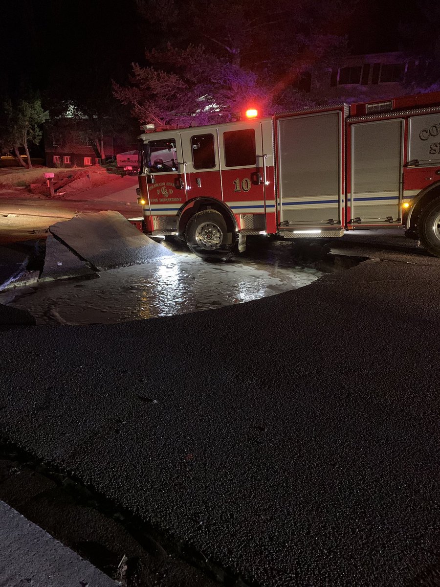 CSFDPIO's tweet photo. Close call for Engine 10 this morning. While at a structure fire, Engine 10 sank into a sinkhole caused by a water main break. No injuries to FF’s and minor damage to the bumper. Engine 10 is the CSFD’s newest @PierceMfg that went into service 1/22/2021. #coloradospringsfire https://t.co/r9iVFzmVIY