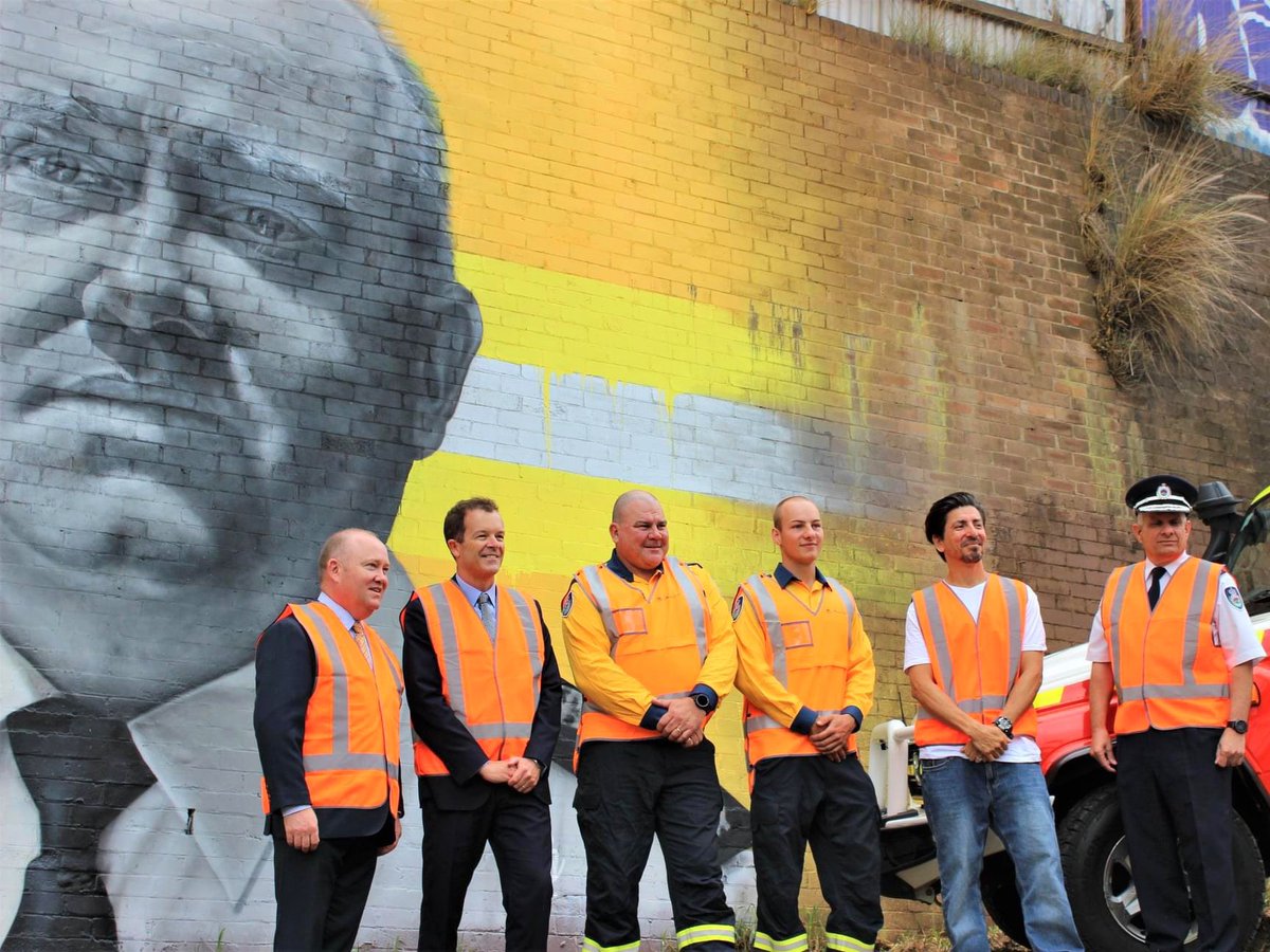 MarkSpeakman's tweet photo. Fantastic morning launching #Graffiti Removal Day 2021, with the unveiling of an extraordinary mural by renowned #streetartist @SidTapia, dedicated to @NSWRFS volunteers + former Commissioner @ShaneFitzAU for their efforts battling the Black Summer #bushfires. 🔥 
#streetart https://t.co/DHHZmbXgZX