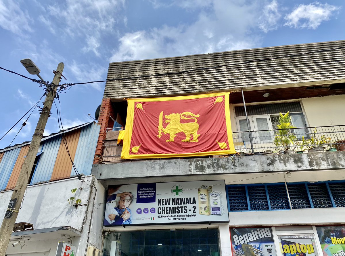 ThyagiR's tweet photo. This was taken on Sunday, 3 whole days after Independence Day celebrations when smaller flags of this racist version of the national flag donned the junction at Koswatta, Nawala, along with this massive display of intolerance and Sinhala supremacy. https://t.co/5QvZv2lTr4