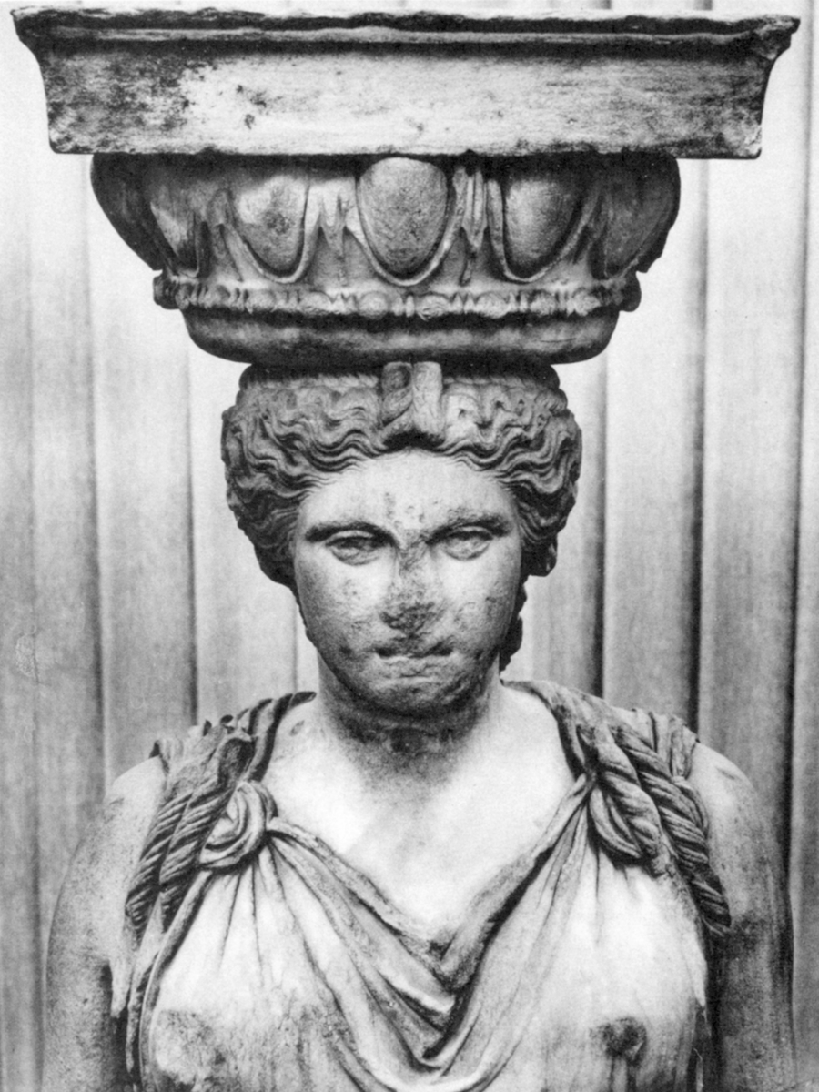 Her bracelets follow the classical models quite closely (cf. a fragment from the Rome copies and, again, the Tivoli copy). The capital, of course, has made way to a vegetal crown.