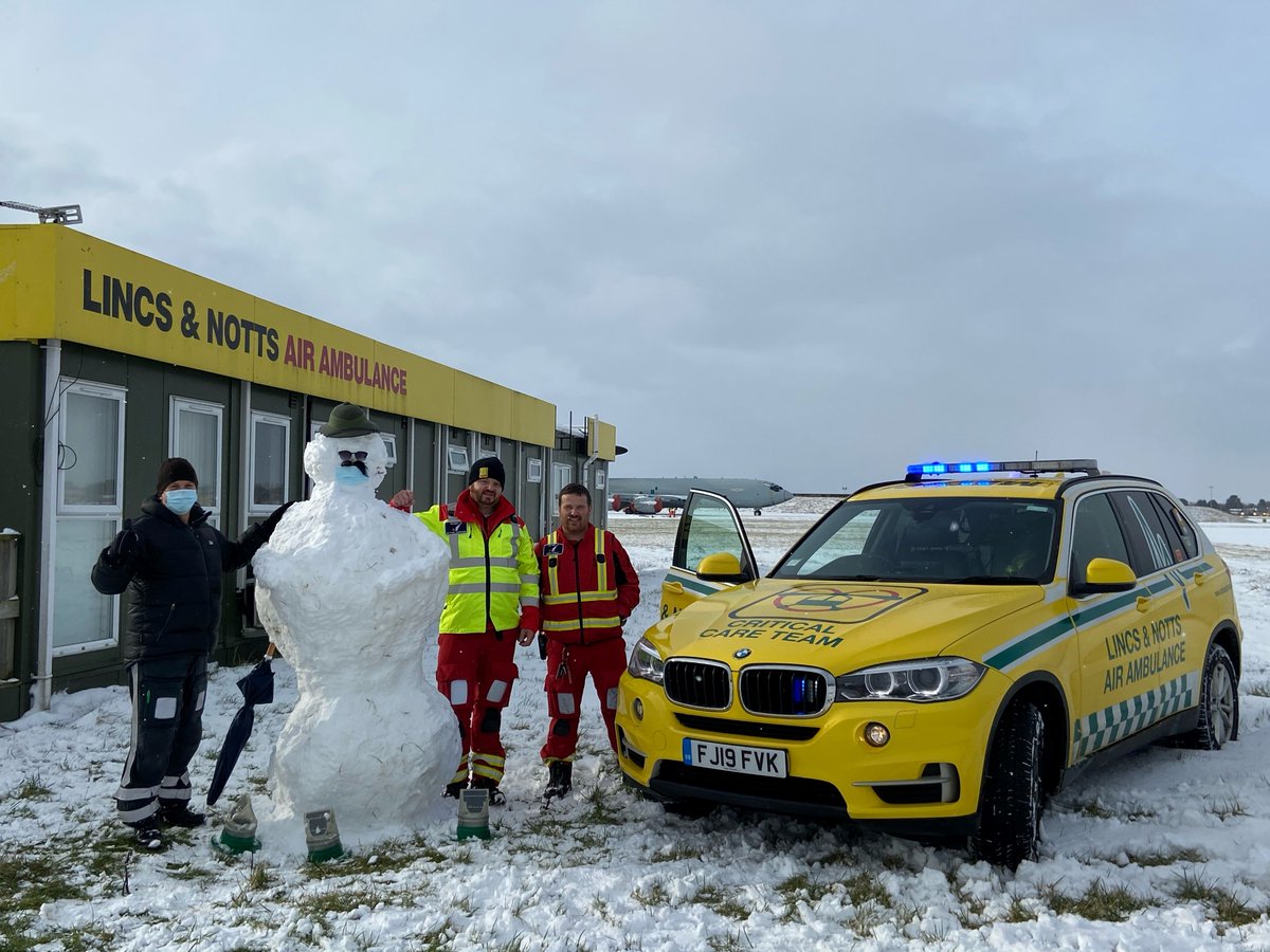 Do you want to build a snowman? Here's our on-duty crew standing proud next to their creation! ☃️❄️