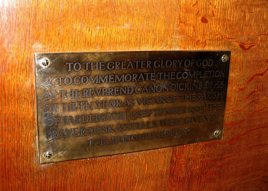 Returning to the chancel, the carved oak stalls and canopied priest's desk are also designed & detailed in a manner to respect the Georgian church. A brass plaque records the fact that they were the gift of the parishioners to commemorate their vicar's 50 years of incumbency.
