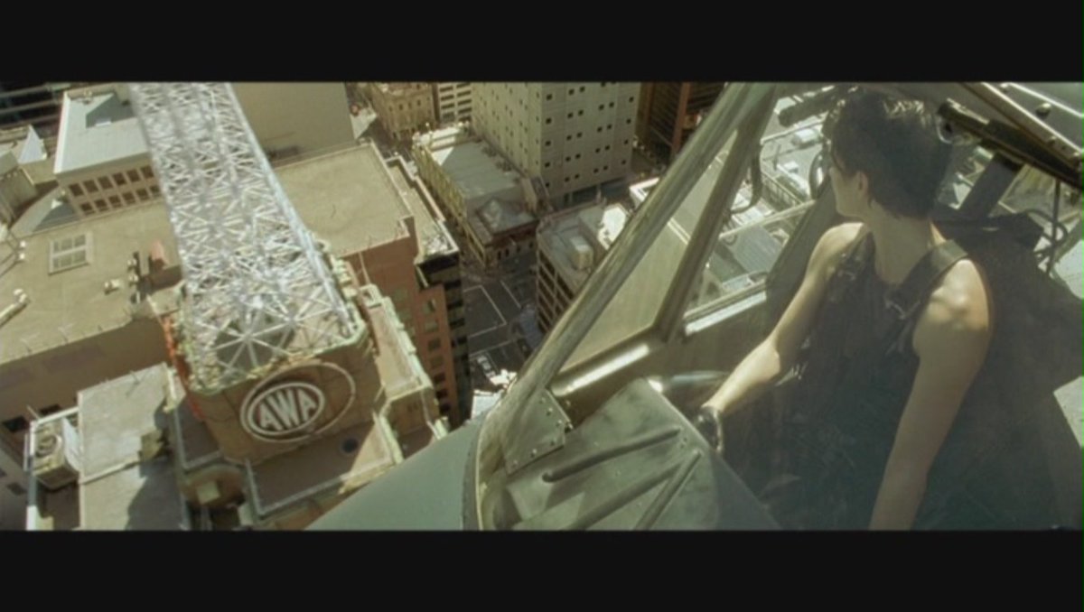 It shows up later, during the rescue of Morpheus. The flyover of Sydney features a nice shot of the tower and its big letters.Every shot in this is a work of art, but the Wachowskis are also incredibly smart filmmakers. They pack each frame with literary meaning & metaphor.4/