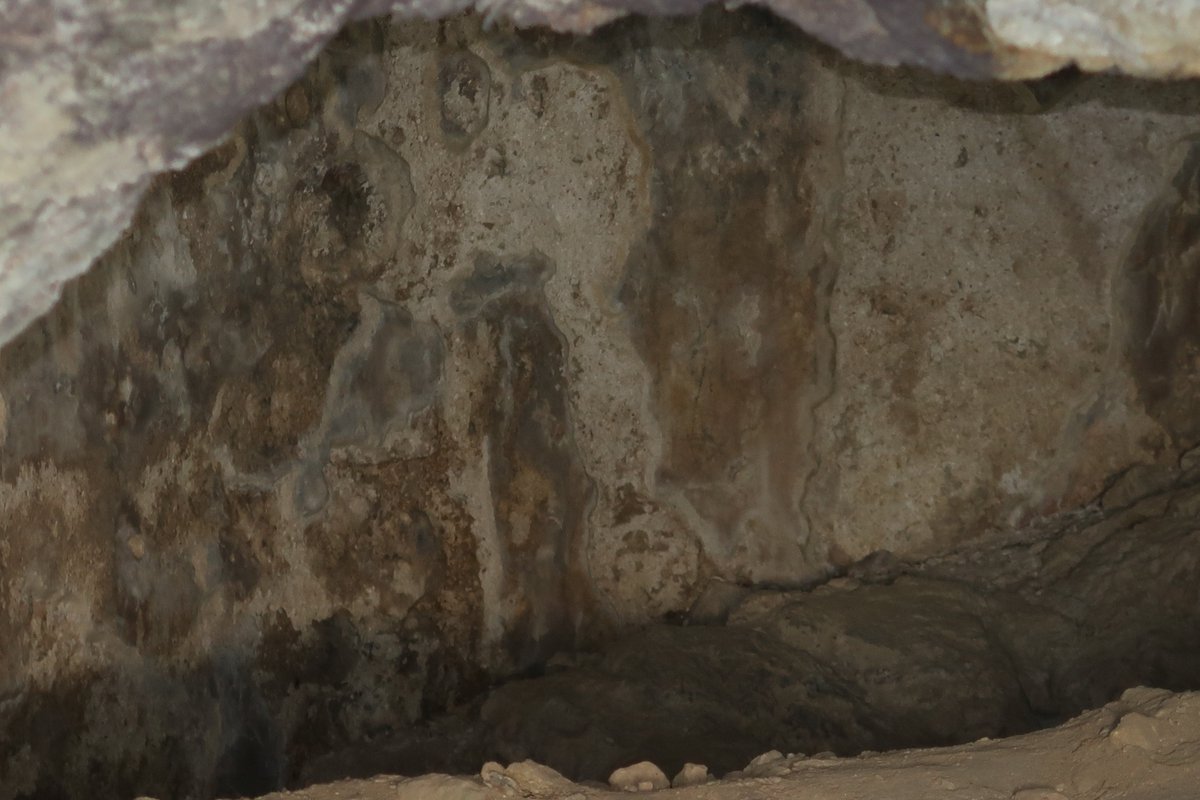 5/10 Near the cistern is a small cave where it is thought that baptisms were conducted in Byzantine period. I took a photo through the bars blocking the entry with the flash on and it is possible to see (just) the remains of frescoes, or at least plastering, on the walls.