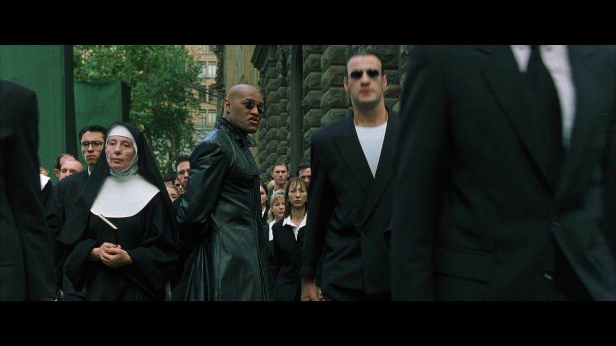 Remember the Agent Training program and the Woman in the Red Dress? That scene has loads of twins in it. Which is pretty cool. You only get a really good glimpse when they go wide with it. But you do see a load of black-suited automatons, including nuns and sailors.14/