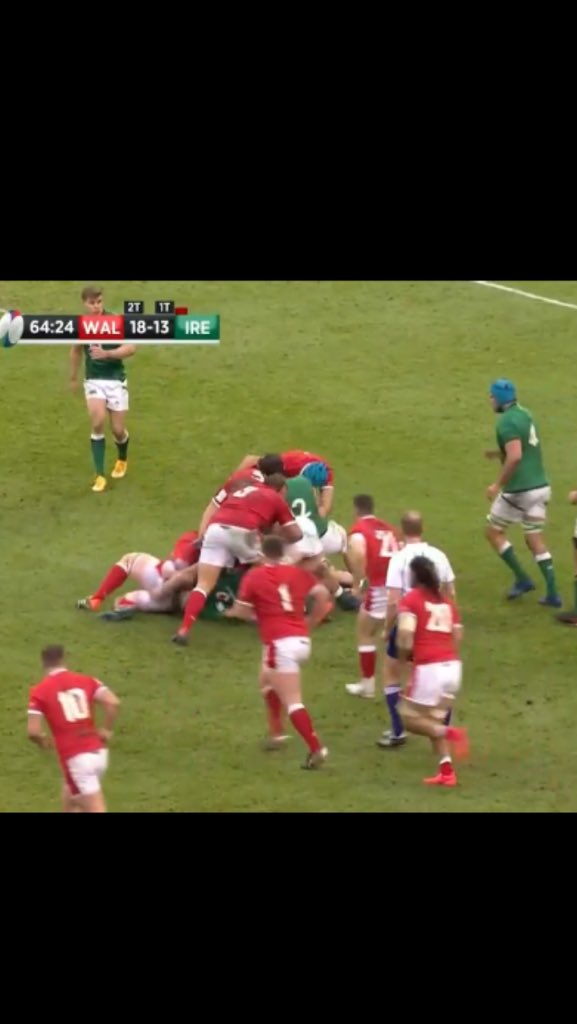 Ball carrier on the ground. Three Welsh players and one Irish player on their feet in contact over the ball.No longer a tackle. A ruck. No tackle zone applies. The ruck is over as soon as the ball leaves and anyone behind their offside line, like Tadhg Beirne, may play it.