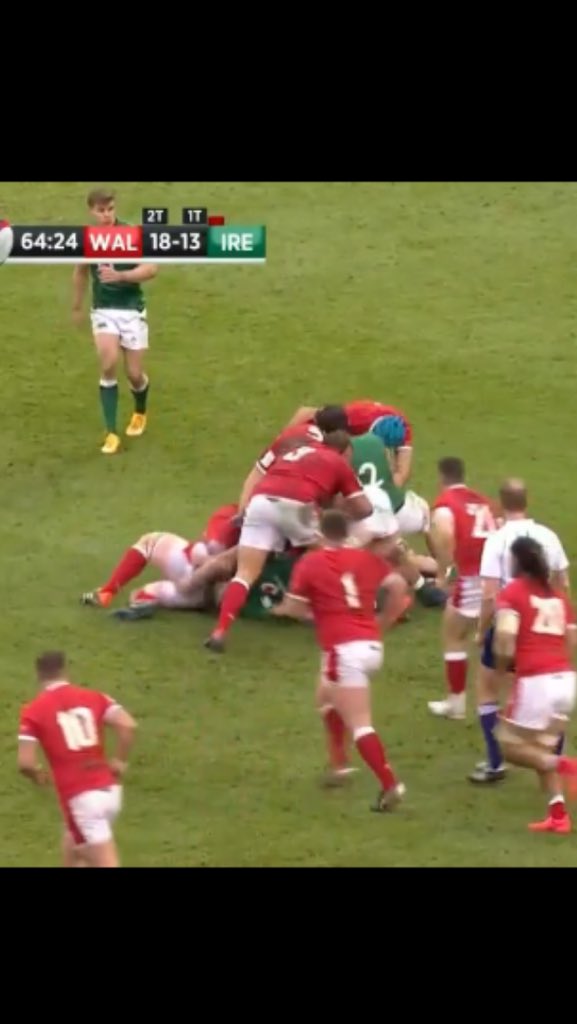 Ball carrier on the ground. Three Welsh players and one Irish player on their feet in contact over the ball.No longer a tackle. A ruck. No tackle zone applies. The ruck is over as soon as the ball leaves and anyone behind their offside line, like Tadhg Beirne, may play it.