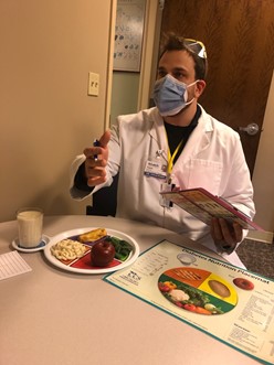 CCCNutrition's tweet photo. #CCCInternsInAction #RD2Be Tristan Symons practices counseling patients before heading up onto the floor during staff relief week. https://t.co/fxmNGeGlir