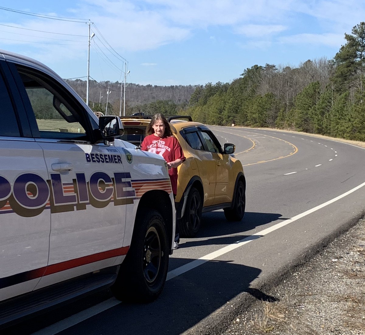 GrimKim's tweet image. This morning, Debbie here was arrested for stealing some of the @BAmazonUnion signs that line the highway in Bessemer. We’d previously seen her harassing union organizers by the warehouse. She told me she’s stolen “about 12” signs and intended to steal more. She left in handcuffs