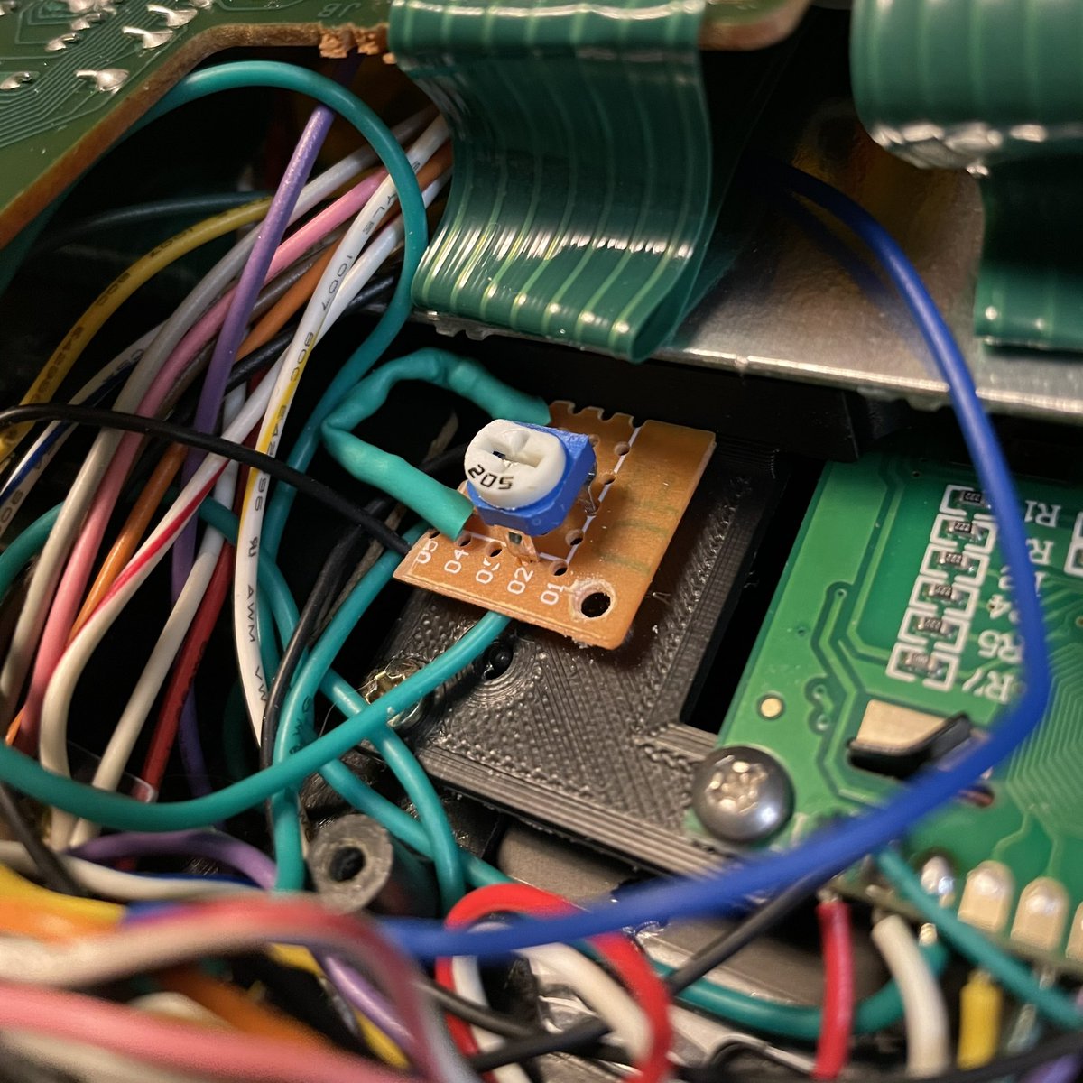 Control mounted with a blob of hot glue. It’s mounted to the 3D printed bracket not the actual keyboard, so everything we’ve done is non-destructive and this synth can be restored back to factory if the owner wants to down the road.