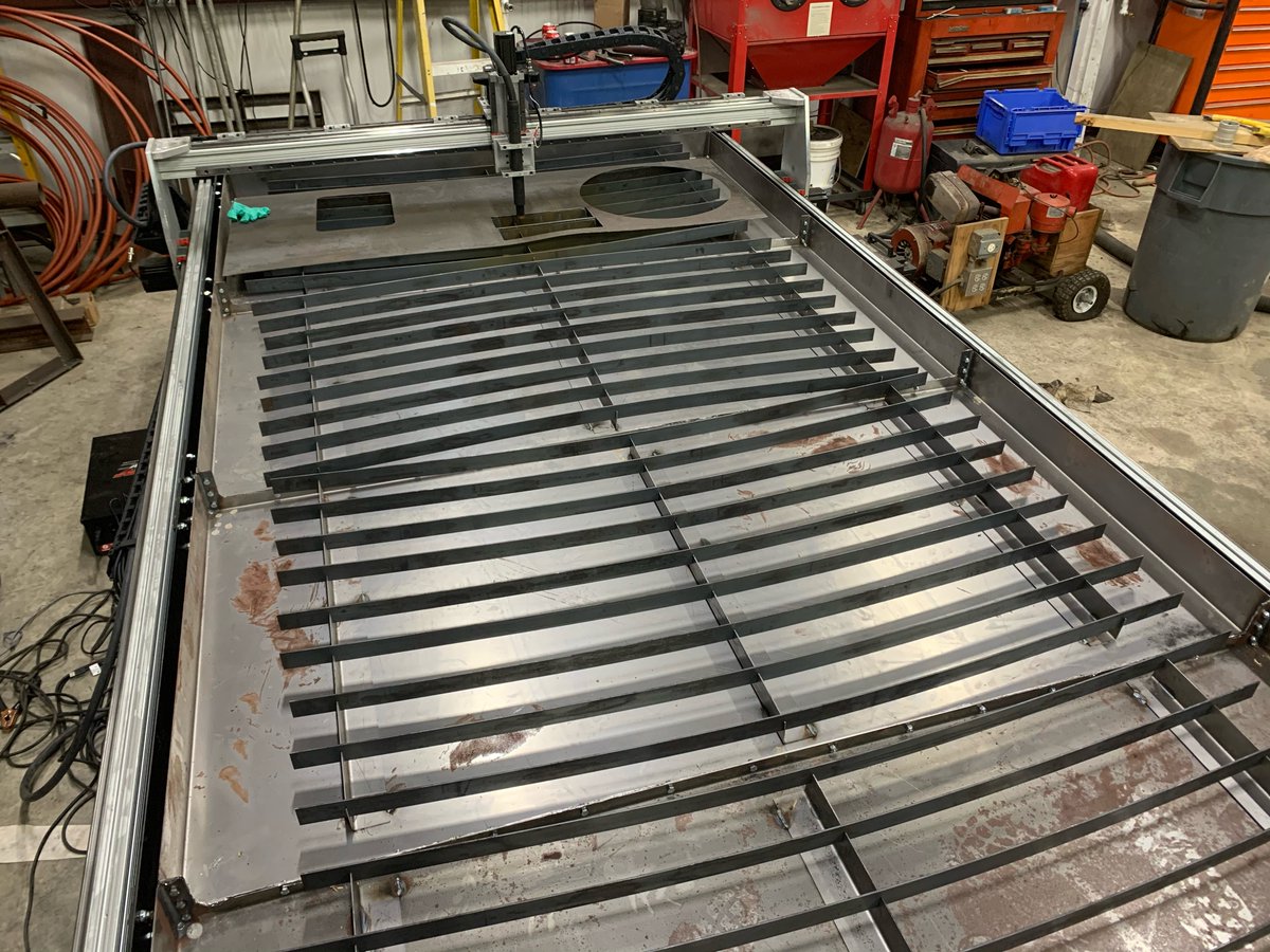 CentauriMetal's tweet photo. Almost got this bad boy fully operational. Ignore the warped metal, just from some test cuts before we could fit the water table. #cnc #metalworking #makers https://t.co/O5dkGGKVBo