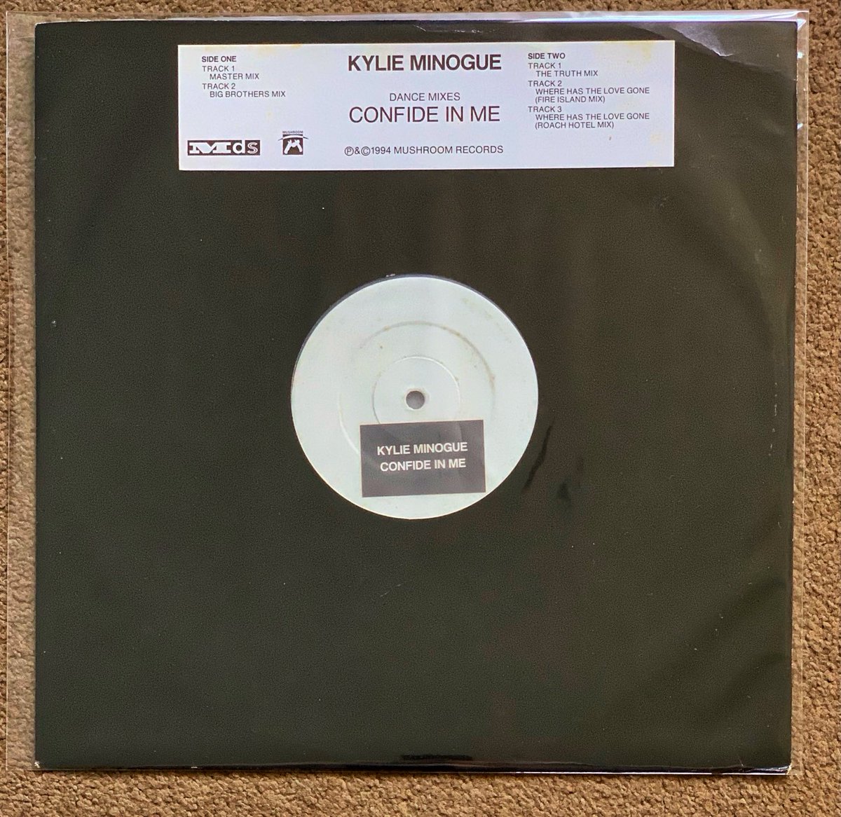 spjury's tweet photo. #KylieMinogue Confide In Me. A rare 1994 #MushroomRecords promo 12” of my favourite 90s track. Unfortunately starting to show is age with some discolouration of the labels & title sticker, but still a great addition the collection. #Vinyl #RareVinyl #PromoVinyl #AustralianPromo https://t.co/Ov3rOmeUf1