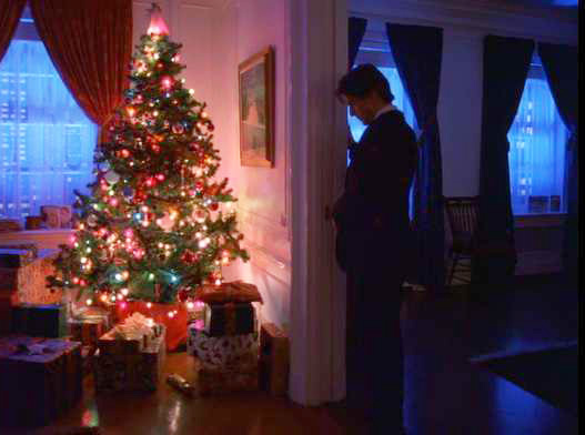 38\\Kubrick sets the story during Christmas time, I suspect, so he could include multiple Christmas trees awash in the colors of the rainbow (He is also commenting on the crass commercialization of a religious holiday).