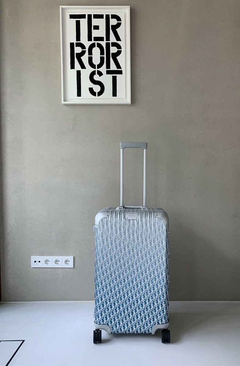 This bizarre eBay ad kinda sums up travel today. Someone wants to sell their designer suitcase for $8,312.78 under a overly hip picture of the word "Terrorist" Travel is so yesterday.  https://www.ebay.com/itm/Rimowa-x-DIOR-Original-Topas-Trunk-Multiwheel-blue-LIMITED-EDITION/303609041778?hash=item46b0825372:g:ciUAAOSwyoBe-cFv