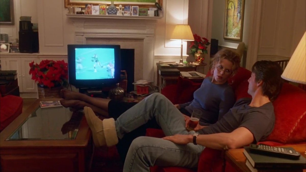 55\\In one early scene, the doctor is chilling in his beautiful Manhattan apartment, wearing his Uggs, watching football with his beautiful wife (note the mirror at Alice’s feet). He looks very comfortable.