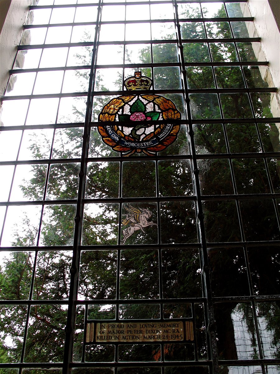 A. J. Davies of the Bromsgrove Guild designed this window in memory of Major Peter Dixon M.C., who was killed in action in 1945 & is buried in the Reichswald War Cemetery. At the time of his death he had left QOWH & joined No. 4 Airlanding Anti-Tank Battery Royal Artillery Rgmt