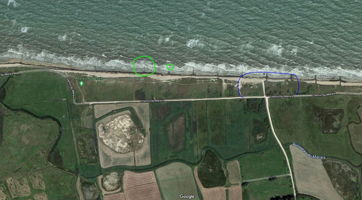 It's here on Gold Jig Red Beach. The location of the craters is in green, and in the bottom right of the image is a portion of strongpoint WN-35, shown in blue. The right side of the photo is actually the boundary between Jig and King beaches. Google