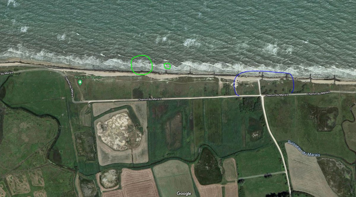 It's here on Gold Jig Red Beach. The location of the craters is in green, and in the bottom right of the image is a portion of strongpoint WN-35, shown in blue. The right side of the photo is actually the boundary between Jig and King beaches. Google