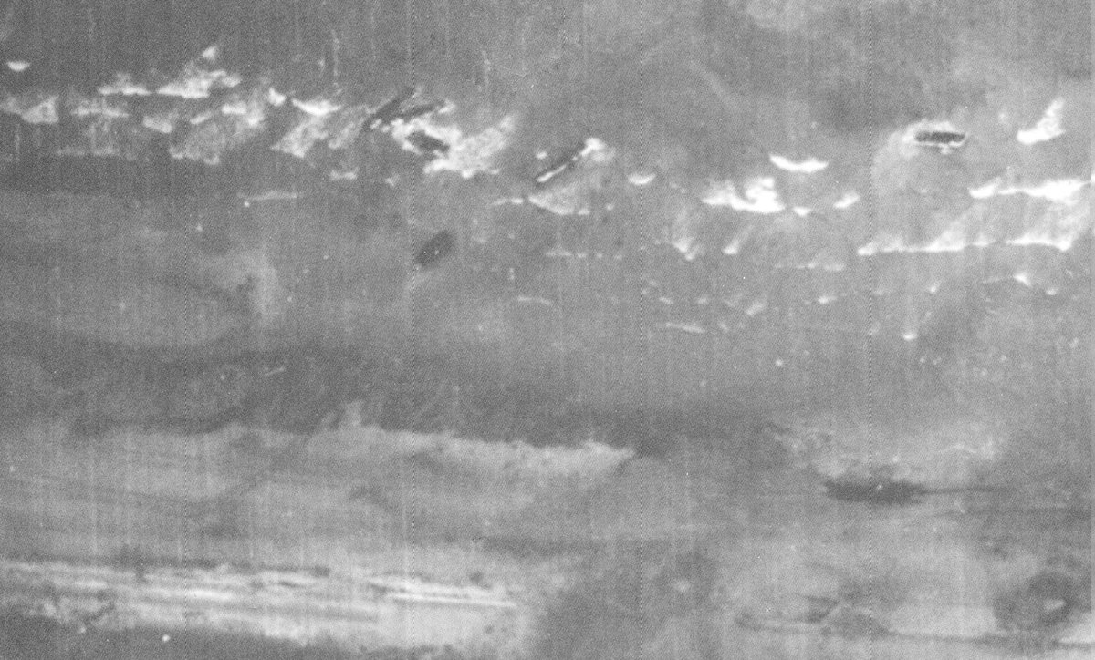 So, the tide has come in more quickly than expected – something recorded in post action reports. The black dots amongst the surf are beach obstacles, which is likely why these LCAs are unloading there.