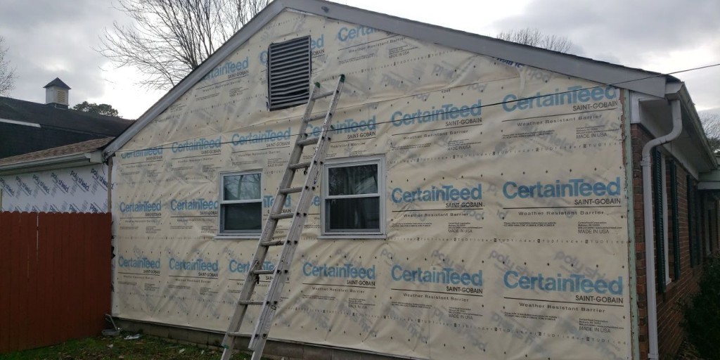 ExteriorSource's tweet photo. A lot goes into putting new @CertainTeed siding on a home 🏚️.  Here you see a before-after view of weather resistant barrier installed, followed by the new blue siding.  
#CertainTeed #siding #homeimprovement #BeautifulExteriors   #ExteriorUpdate #Exteriors #curbappeal https://t.co/pSG9wQ3aXx