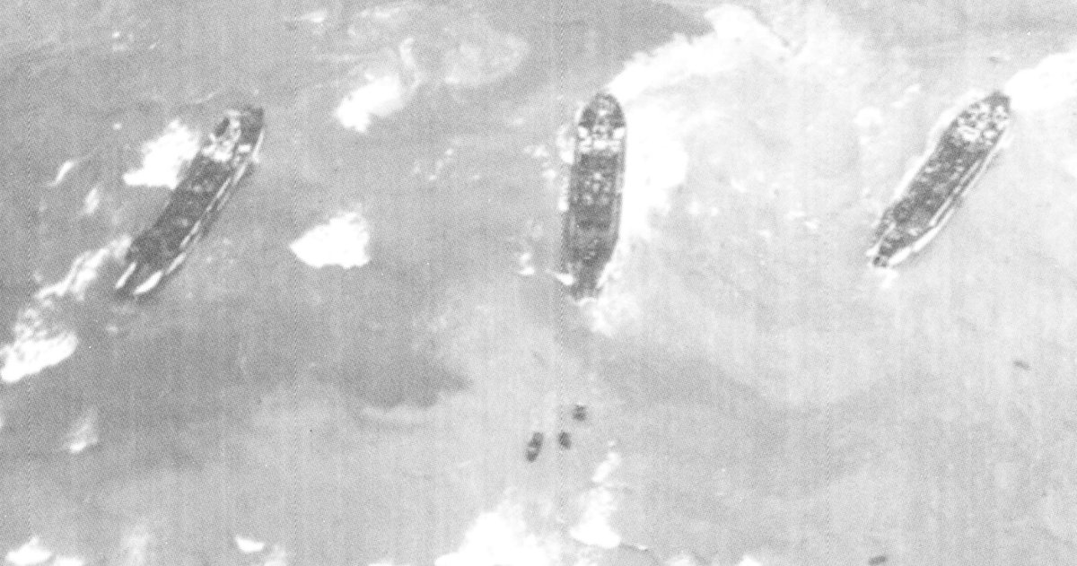 Further out are a number of LCT Mk IV. They have been forced to unload much further out than is ideal and the vehicles will wade in, which led to many trucks 'drowning'.