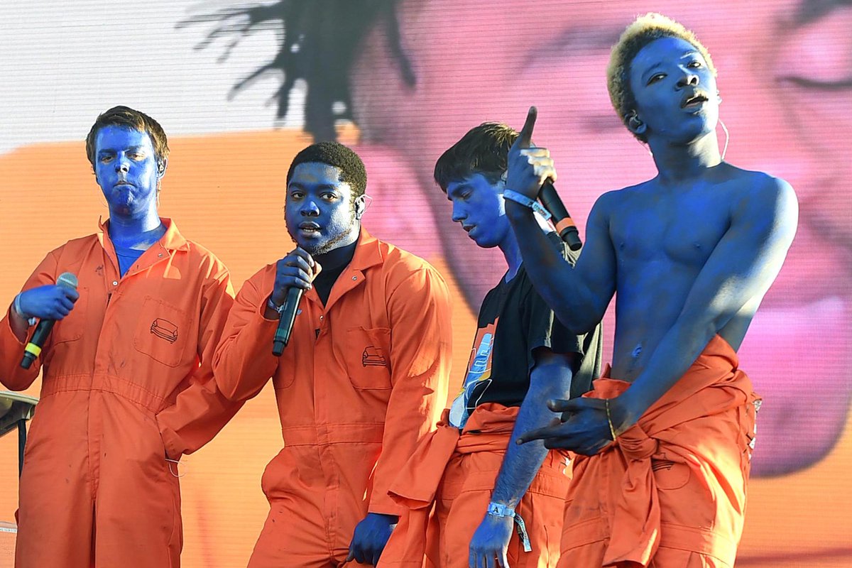 let's just look at the difference between saturation era and iridescence era.the initial use of blue paint plays off the masculine associations of the color. using orange, the exact opposite of blue, for the jumpsuits emphasized the 'saturation' themes