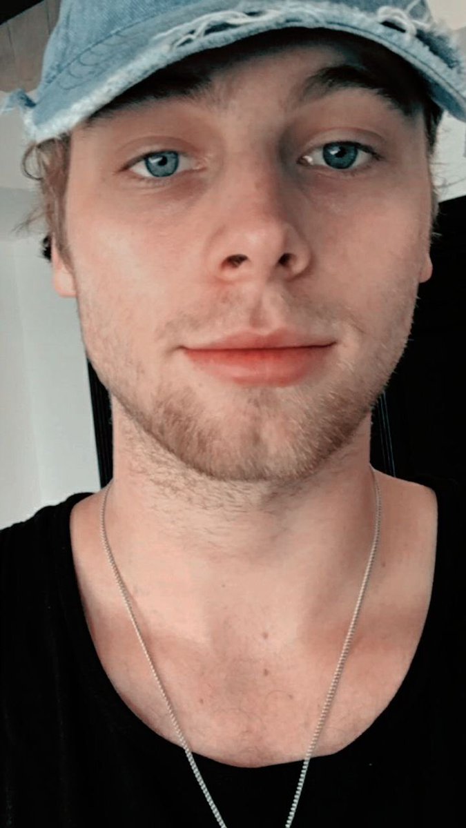 the most beautiful shade of blue represented by luke hemmings eyes; a thread