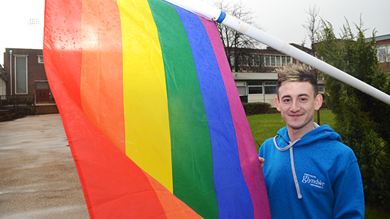 WUResearch_'s tweet photo. #Glyndwr is flying the flag in support of LGBT History Month - pictured is newly-appointed LGBT sabbatical officer, @MarcCaldecott, who is currently researching perceptions of same-sex parenting for his degree in Family &amp; Childhood Studies https://t.co/kbNd8uh0j1 🏳️‍🌈 https://t.co/3uJ8OhpAAc