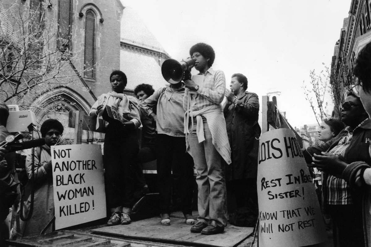 At an event in late April, 1979, Barbara Smith, with megaphone, protests nine murders of women of color that took place in the first months of the year. Photograph by Ellen Shub / Courtesy the Estate of Ellen Shub. See: https://www.newyorker.com/news/our-columnists/until-black-women-are-free-none-of-us-will-be-free