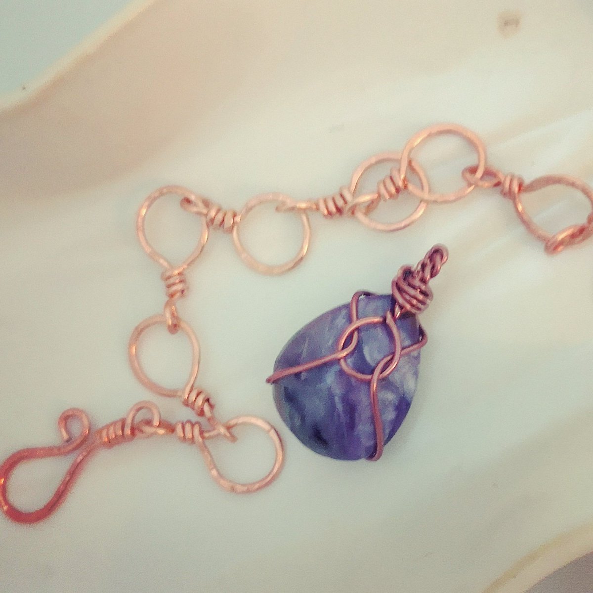 Finally found the confidence to wrap this Charoite cab! Making a chain too, but for something else. Not sure if I like the "hammered" look. #wirewrappedjewelry #wireworkjewelry #charoitejewelry #charoite #healingjewellery #healingcrystals #shoplocal #shopcanadian #lovethevibe