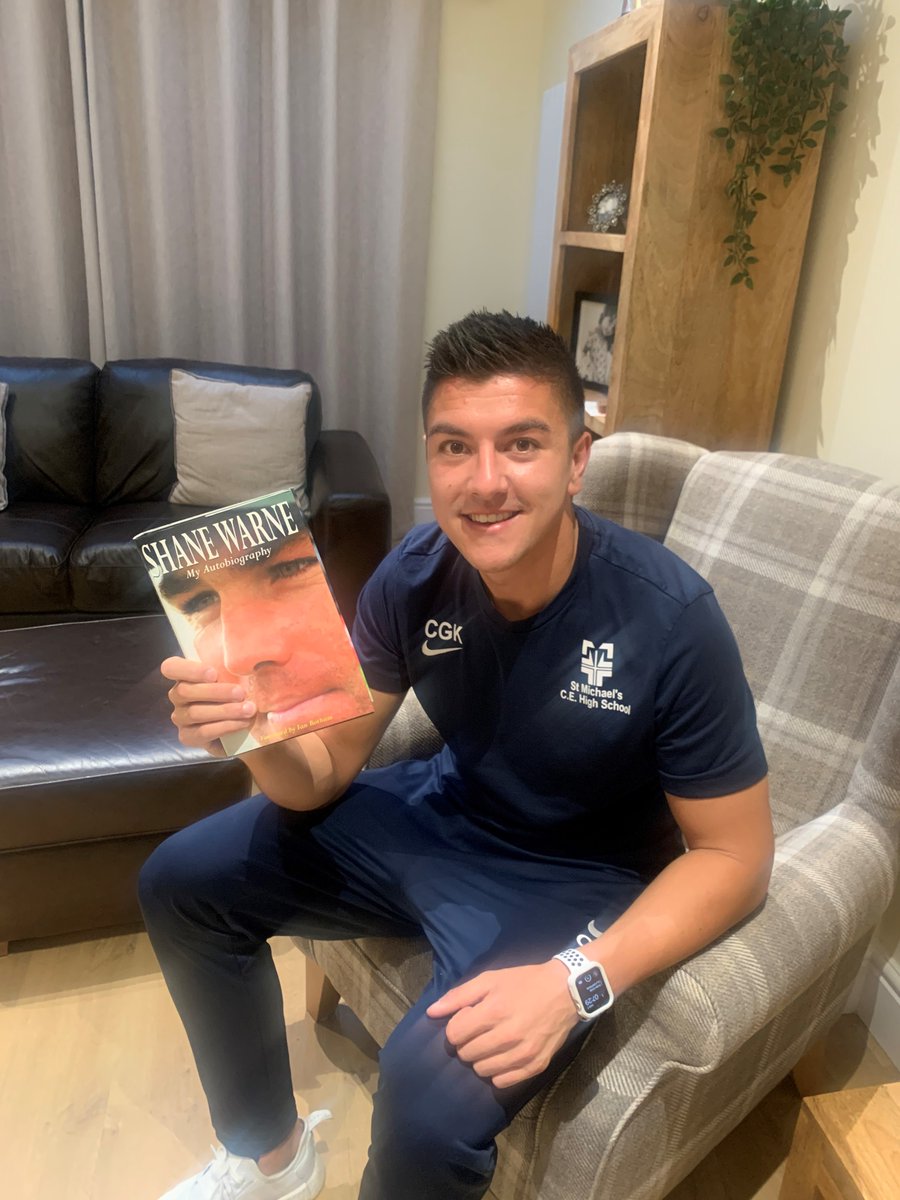 SaintMichaelsCE's tweet photo. Reading In PE: We do like our Cricket in the PE Department 🏏. After our tweets about Mr Holden’s passion for the sport before half term, we also know that Mr Kohler loves his Cricket too. Here he is reading Shane Warne’s autobiography #StMichaelsSports #ReadingInPE https://t.co/PiQQQQEpPf