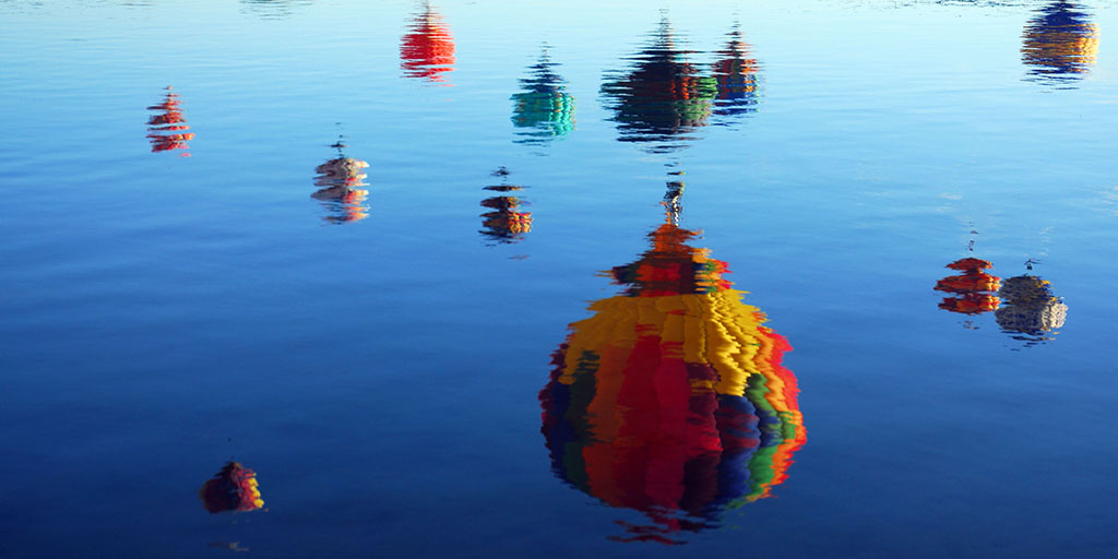 At the annual Labor Day Lift Off in Colorado Springs, Colo., Betsy Ogan captures balloons reflecting off Prospect Lake.

<a href="/MensaBulletin/">Mensa Bulletin</a> #OpeningShots