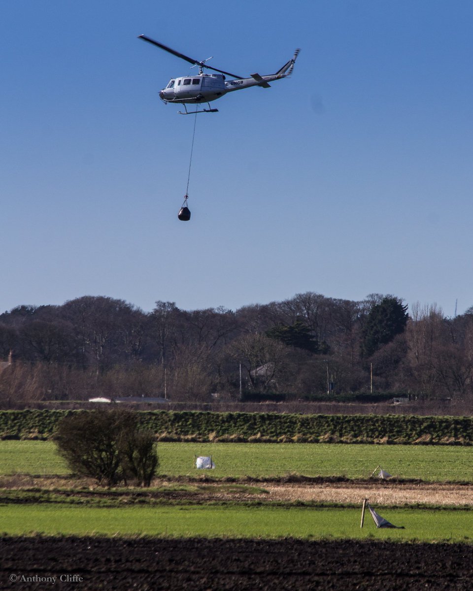 TonyCliffe210's tweet photo. Great to see the iconic Huey Helicopter brought in to repair the Alt breach @EnvAgency @WildlifeTrusts @BBCNWT #Lunt #RiverAlt https://t.co/X2ogbpFM5R