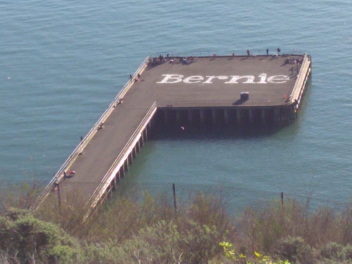 ChalkBernieToMe's tweet photo. My proudest work next to the Golden Gate Bridge. 90 ft across. Please help me make a book of my guerrilla artwork. I chalked Bernie's name 250 times across the country. A testimonial or retweet would go far. @briebriejoy @NaomiAKlein @kthalps @janeosanders https://t.co/5gQK8ZYhNH