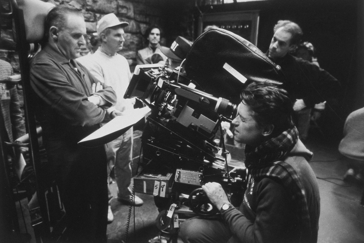 Criterion's tweet photo. Remembering the remarkable Jonathan Demme, who was born on this day in 1944. Here he is enjoying some lighter moments on the set of his harrowing masterwork THE SILENCE OF THE LAMBS (1991). https://t.co/LqOIhSFEra