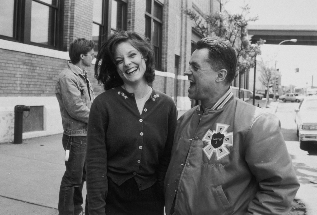 Criterion's tweet photo. Remembering the remarkable Jonathan Demme, who was born on this day in 1944. Here he is enjoying some lighter moments on the set of his harrowing masterwork THE SILENCE OF THE LAMBS (1991). https://t.co/LqOIhSFEra