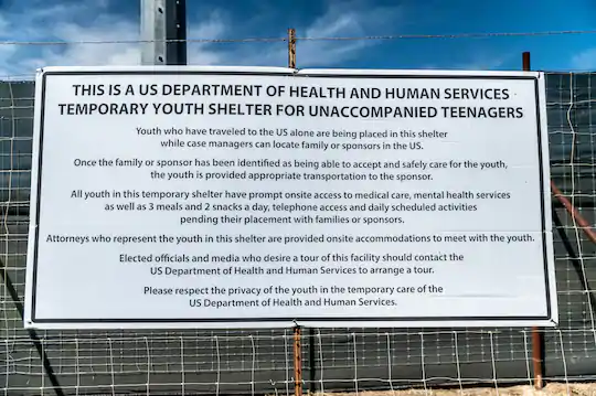 JackPosobiec's tweet photo. BREAKING: Sign outside Biden's migrant children detention center https://t.co/Jr8cPpty94