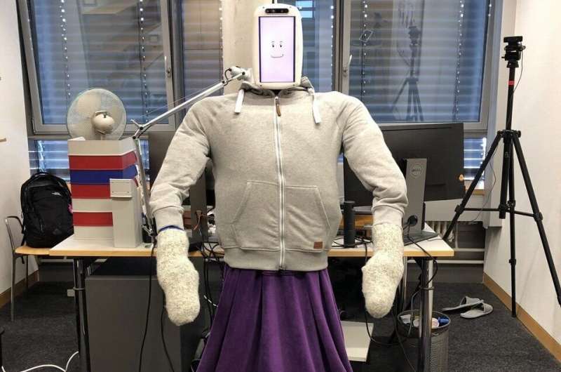 LianeGBenning's tweet photo. in these days of #SocialDistancing we all could use a #HuggieBot urgently - although the sense of fashion  instilled by its #swiss creators leaves a lot to be desired

they could at least have added #BernieSandersMittens https://t.co/GpJaJnWGBN
