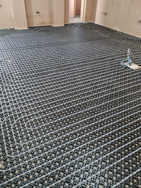 Progress on a full property renovation in #Harrogate... Marble effect wall tiles and parquet effect flooring with #Uponor Minitec underfloor heating.