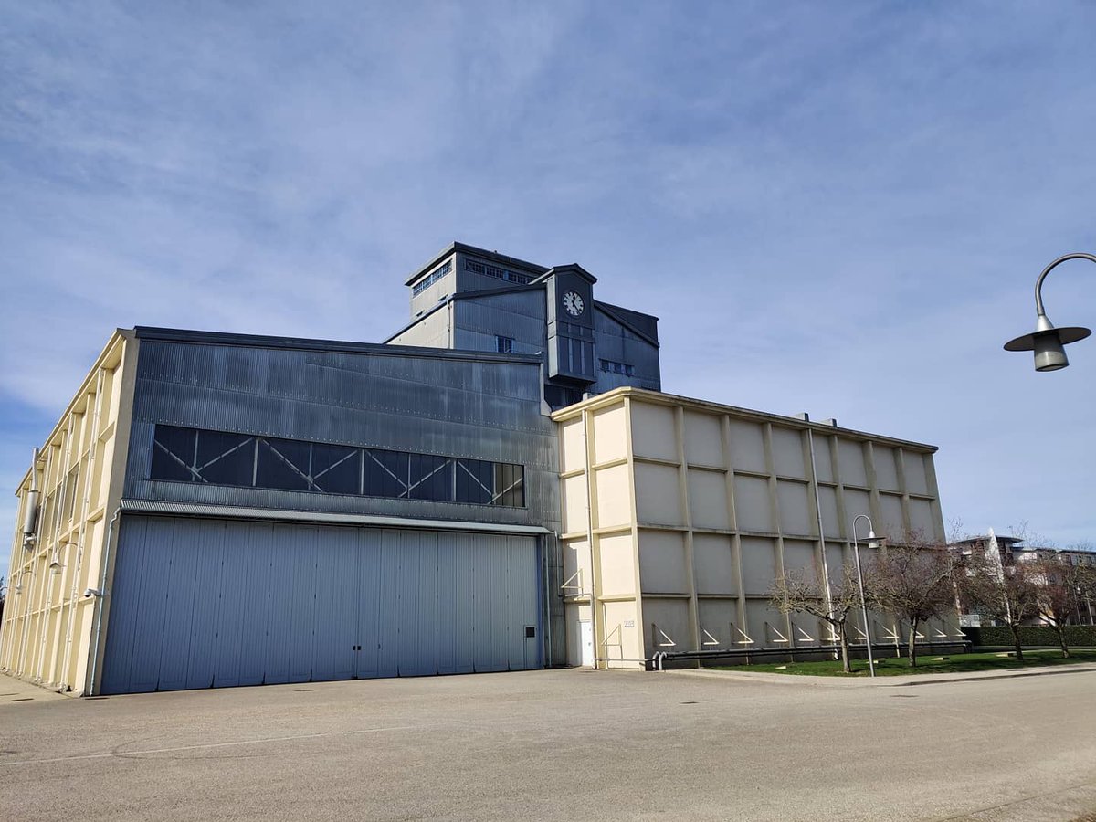TimeAssured's tweet image. The sun&apos;s back out while Mike installs some new opal glass, the clock over looks Britain&apos;s oldest wind tunnels building that has tested everything from Spitfires to Concorde&apos;s.