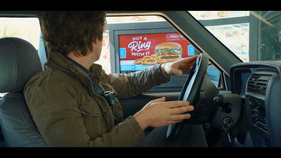 Wait i to drive you. Man talking at a drive trhru meme drawn.