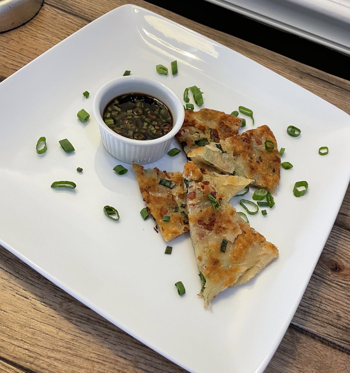 dstanner2's tweet photo. Our residents are enjoying a tasty #TrilogyThemeWeek inspired snack today @MillPondHC. The Scallion Pancakes w/Soy dipping sauce was a savory hit. @RachieFrye @nolafoodguy @fletch42088 #TrilogyTraditionsAsia #TrilogyLiving https://t.co/lt6cXEML8H